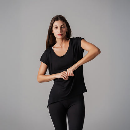 Woman wearing a black outfit on a gray background